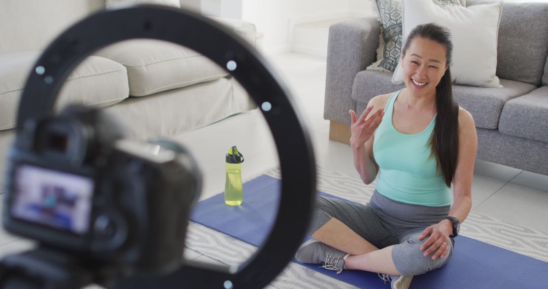 Fitness Influencer Filming Yoga Training Video at Home - Free Images, Stock Photos and Pictures on Pikwizard.com