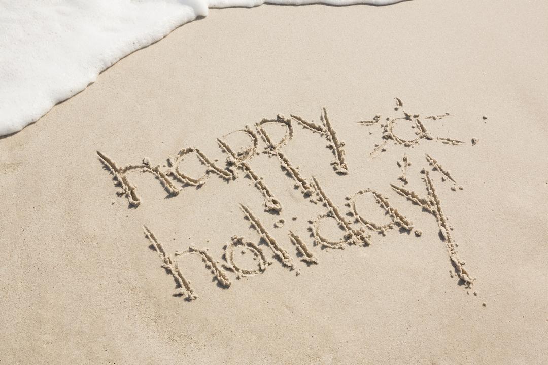 Happy Holiday Written in Sand on Beach - Free Images, Stock Photos and Pictures on Pikwizard.com