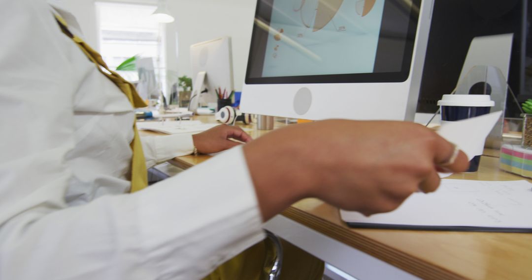 Professional Workspace: Woman Analyzing Data on Computer