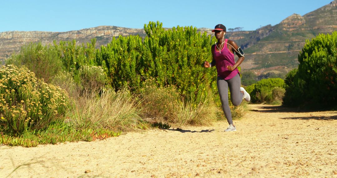 Woman Jogging on a Scenic Nature Trail in Bright Sunny Weather - Free Images, Stock Photos and Pictures on Pikwizard.com