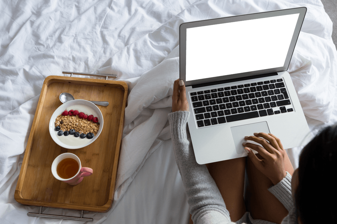 Transparent Screen Laptop by Bedside Breakfast Tray at Home