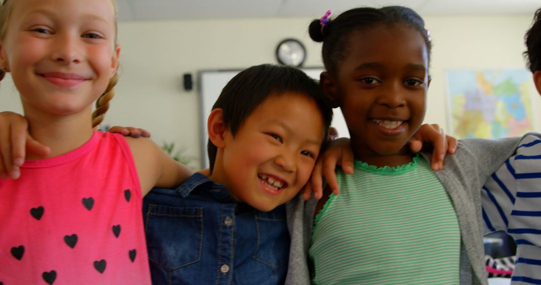 Happy Multi-ethnic Schoolchildren Smiling Together in Classroom