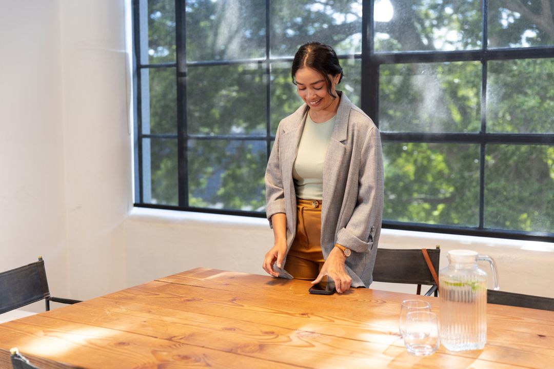 Professional Woman Joining Meeting in Modern Workspace with Lemon Water