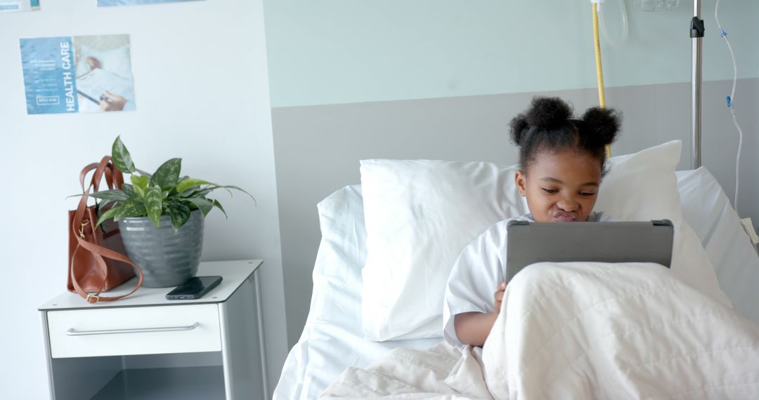 Young Patient Using Tablet in Hospital Bed - Free Images, Stock Photos and Pictures on Pikwizard.com