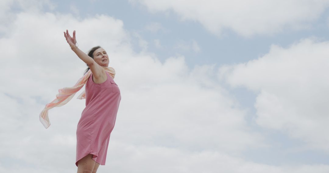 Joyful Woman Enjoying Freedom Under Blue Sky - Free Images, Stock Photos and Pictures on Pikwizard.com