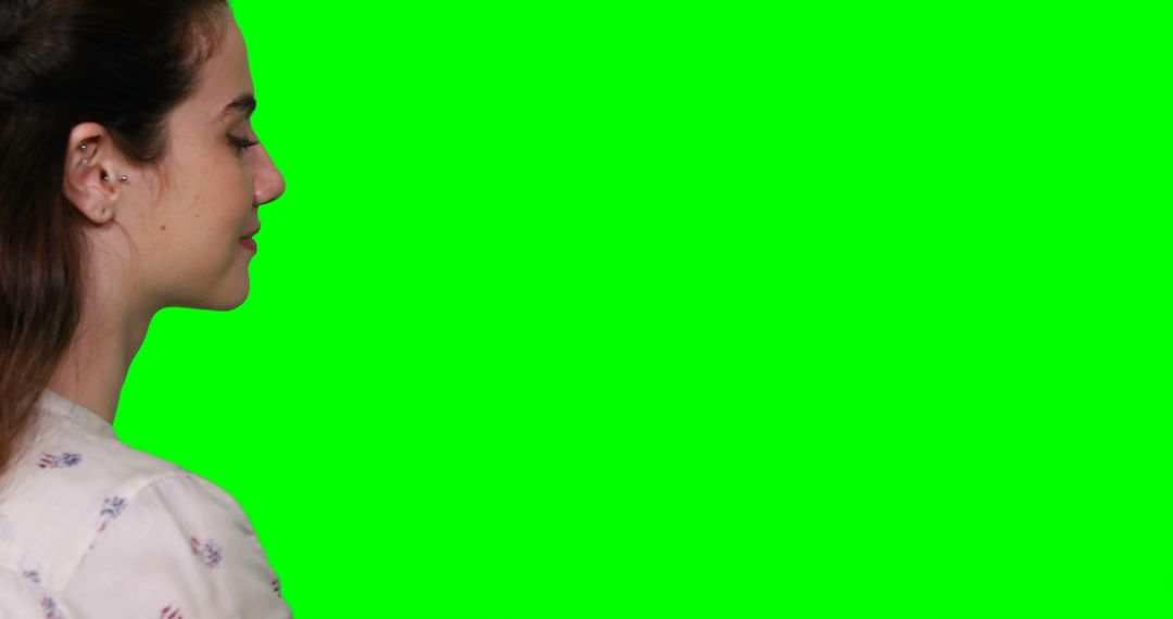 Profile of Woman Interacting with Virtual Green Screen Interface