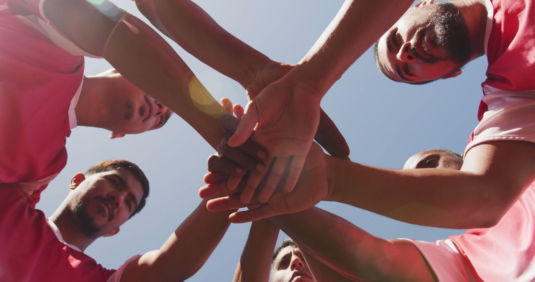 Team of Athletes Huddling in a Circle on Sunshine Day - Free Images, Stock Photos and Pictures on Pikwizard.com