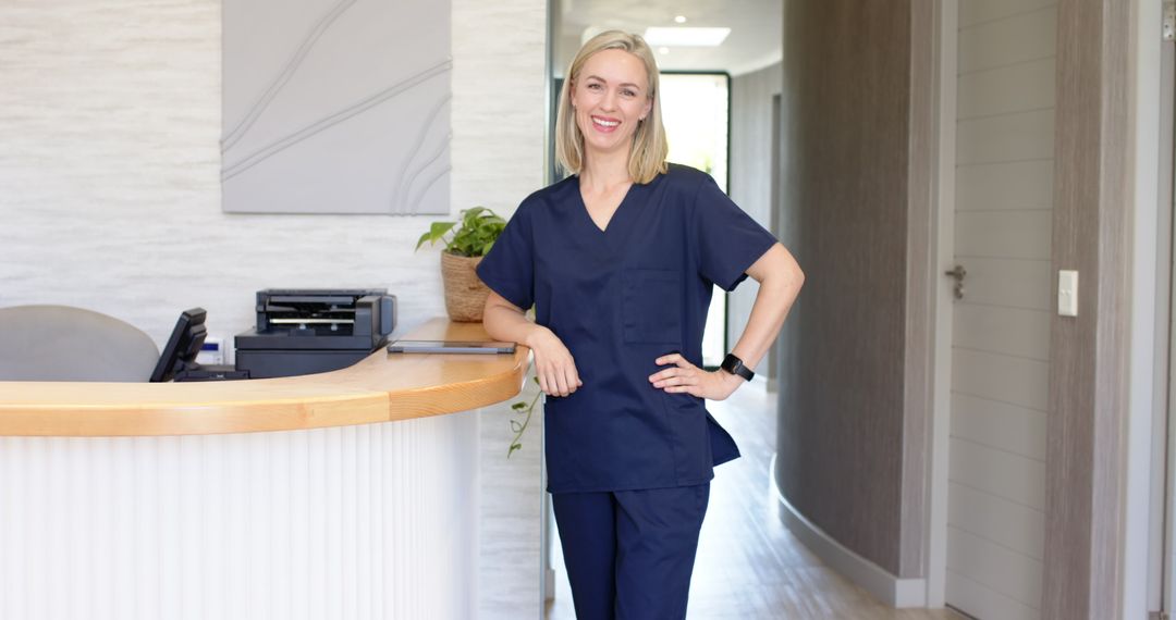 Confident Nurse Using Tablet in Modern Clinic Reception