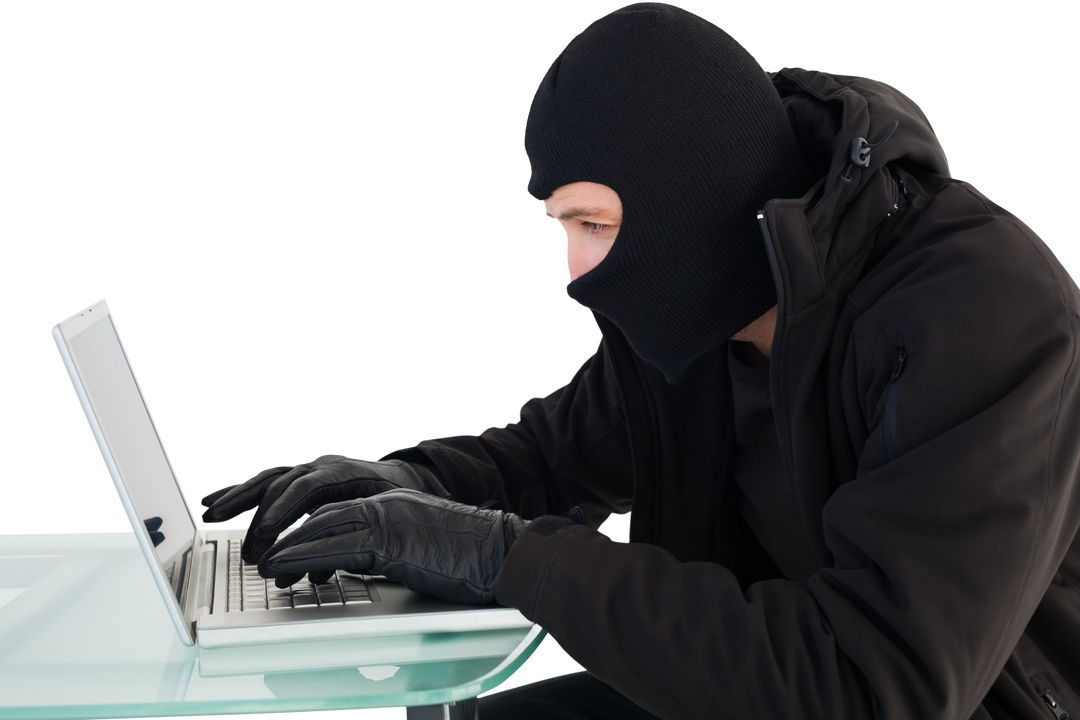 Cyber Criminal in Mask Hacking Laptop at Office Desk on Transparent Background - Download Free Stock Images Pikwizard.com