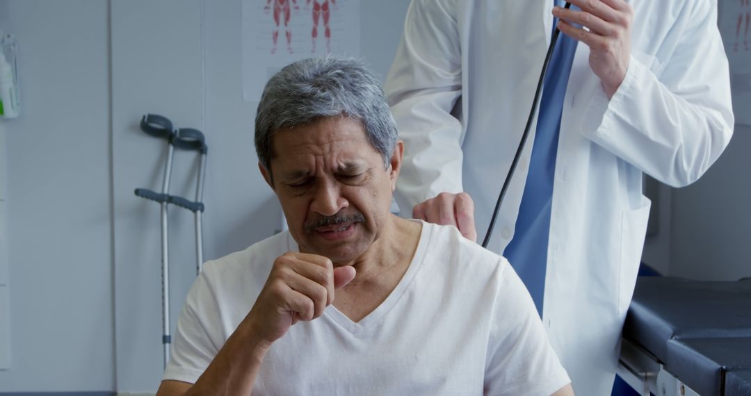 Doctor Examining Coughing Elderly Man in Medical Clinic - Free Images, Stock Photos and Pictures on Pikwizard.com