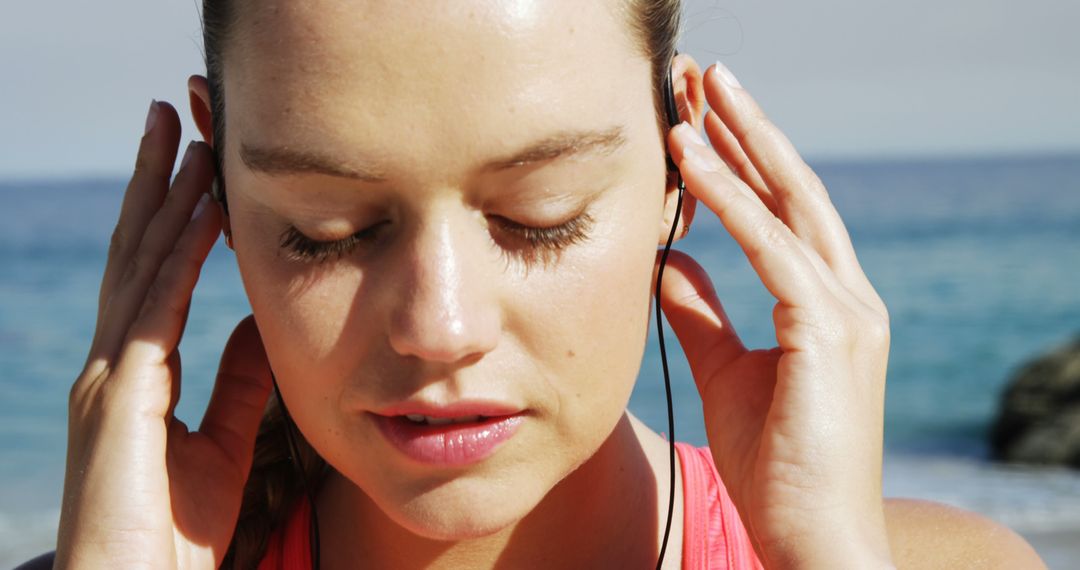 Fit Woman Getting Ready for Beach Run with Earphones - Free Images, Stock Photos and Pictures on Pikwizard.com