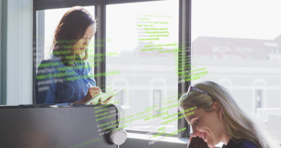 Diverse Colleagues Analyzing Data with Digital Interface in Modern Office