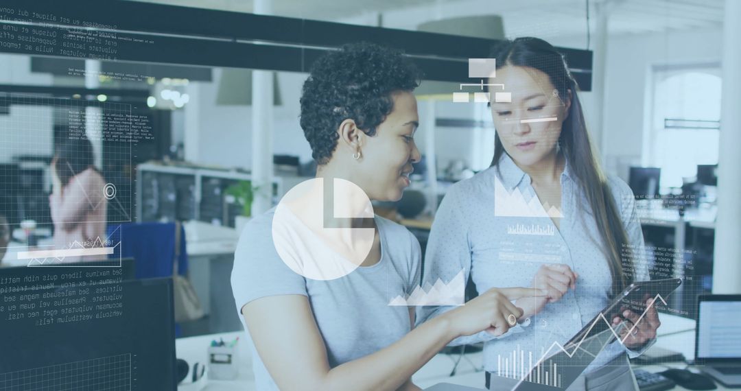 Businesswomen Collaborating with Digital Data Analytics in Office Setting