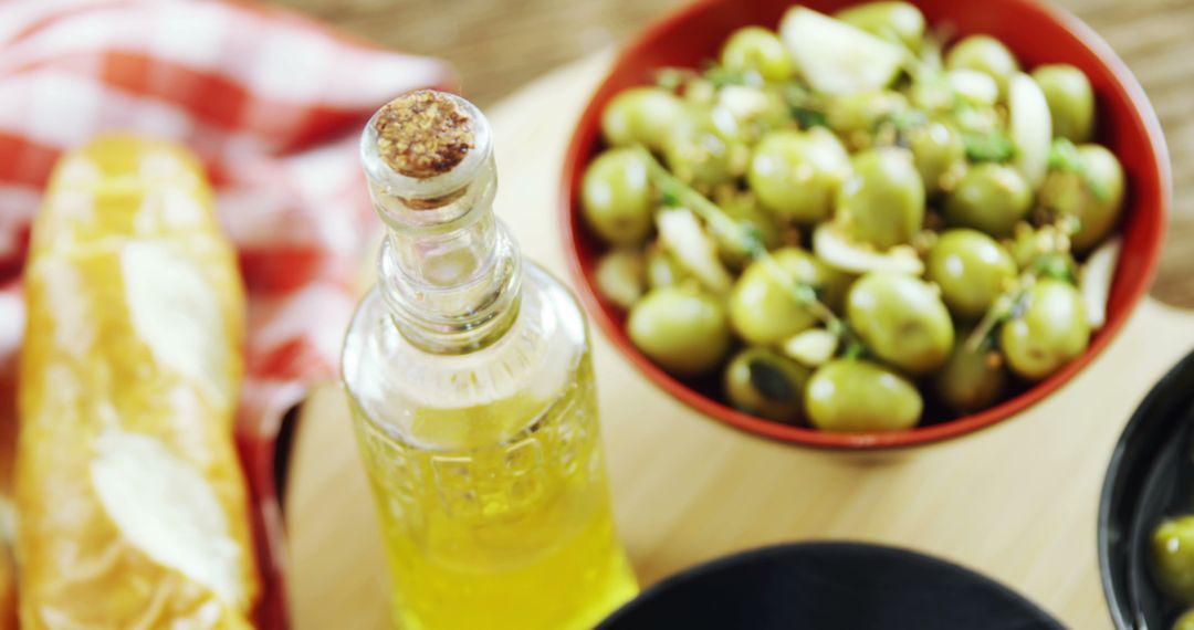 Fresh Mediterranean Olives and Virgin Olive Oil on Wooden Table - Free Images, Stock Photos and Pictures on Pikwizard.com