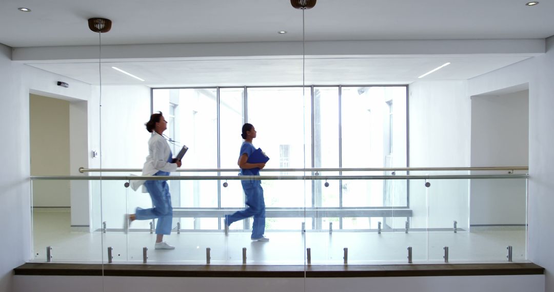 Medical Professionals Rushing in Hospital Corridor - Free Images, Stock Photos and Pictures on Pikwizard.com