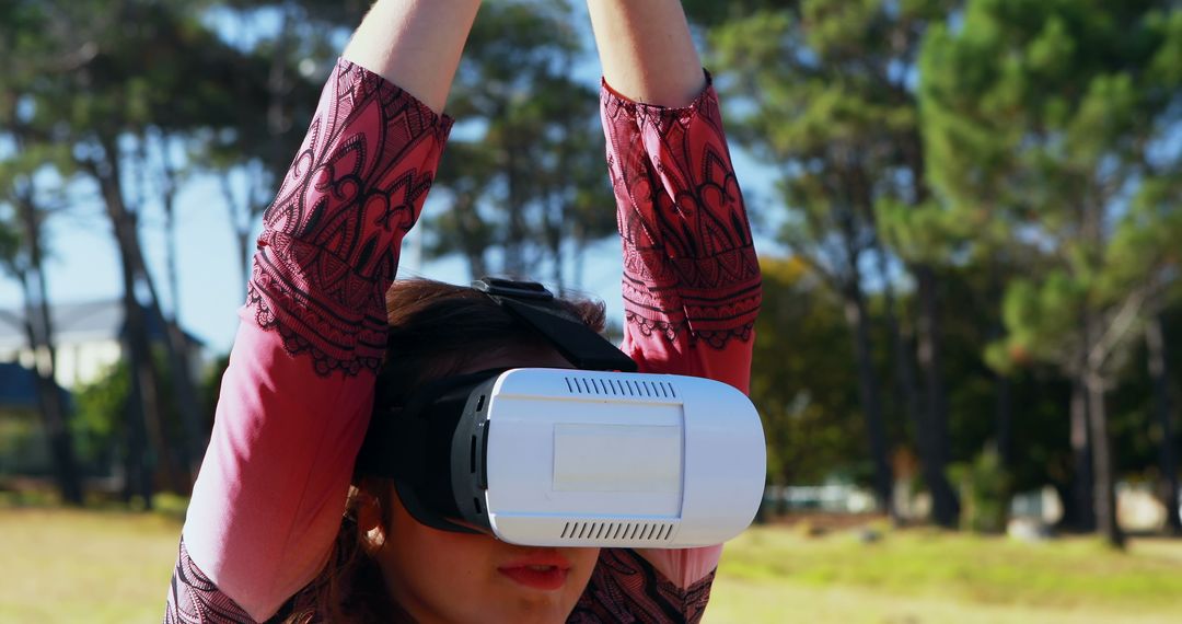 Woman Using Virtual Reality Headset Outdoors in Nature - Free Images, Stock Photos and Pictures on Pikwizard.com