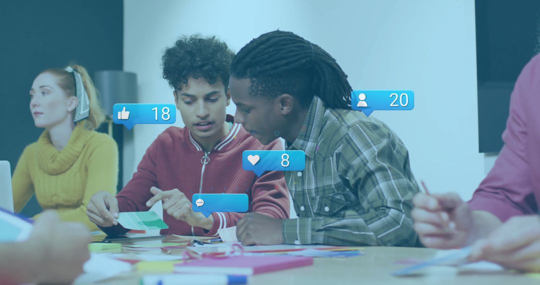 Collaborative Team Discussing Creative Projects with Digital Media