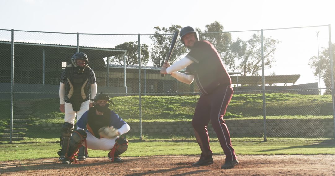 Baseball Players Batting and Umpire in Action on Field