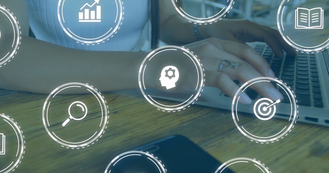 Person Using Laptop with Overlay of Education and Learning Icons