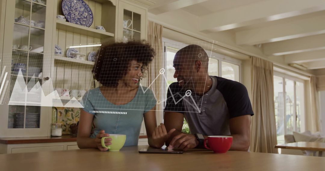Couple Analyzing Data on Tablet in Modern Kitchen