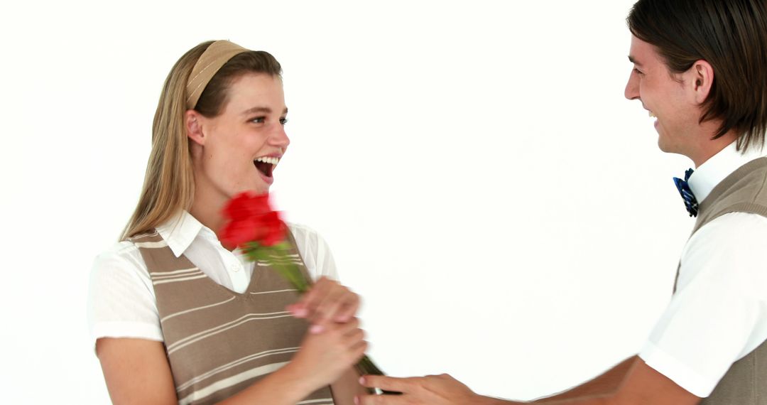 Young Couple Sharing Moment with Red Rose in Bright Studio - Free Images, Stock Photos and Pictures on Pikwizard.com