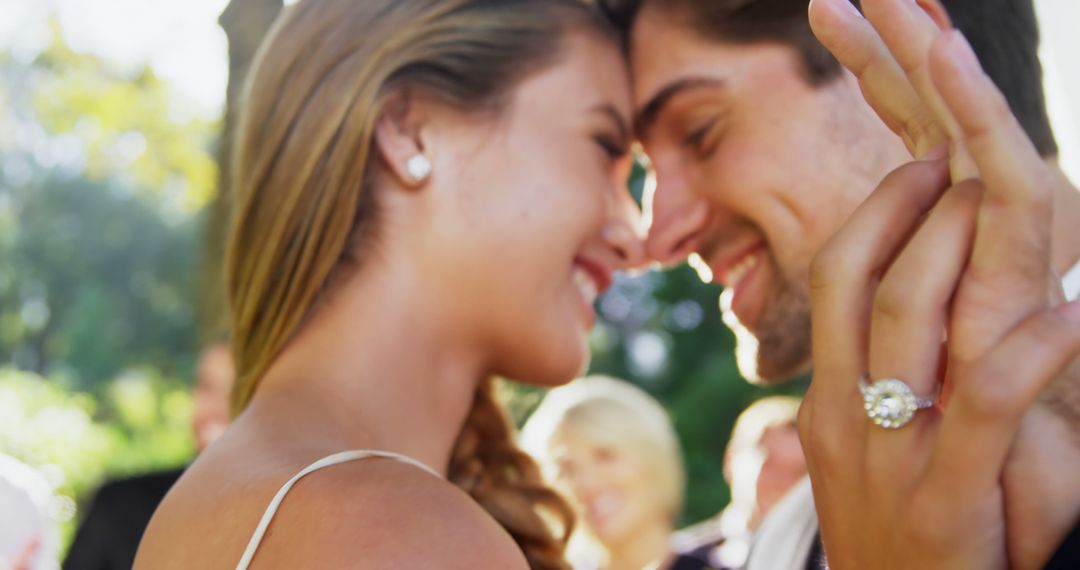 Newlywed couple embracing during outdoor wedding - Free Images, Stock Photos and Pictures on Pikwizard.com