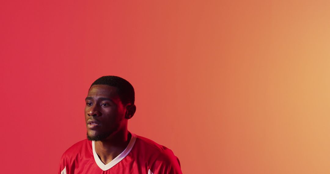 Focused Athlete Taking Break in Dynamic Red Attire