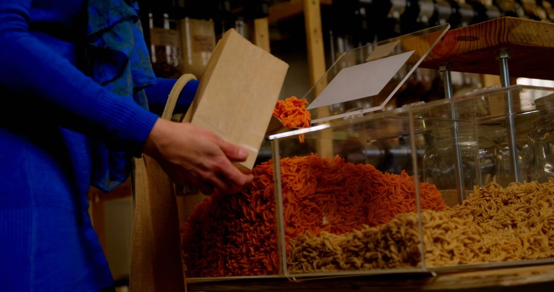 Person Shopping for Pasta in Bulk Store - Free Images, Stock Photos and Pictures on Pikwizard.com