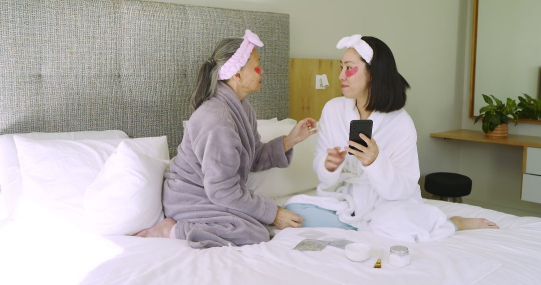 Senior Mother and Daughter Sharing Skincare Routine at Home