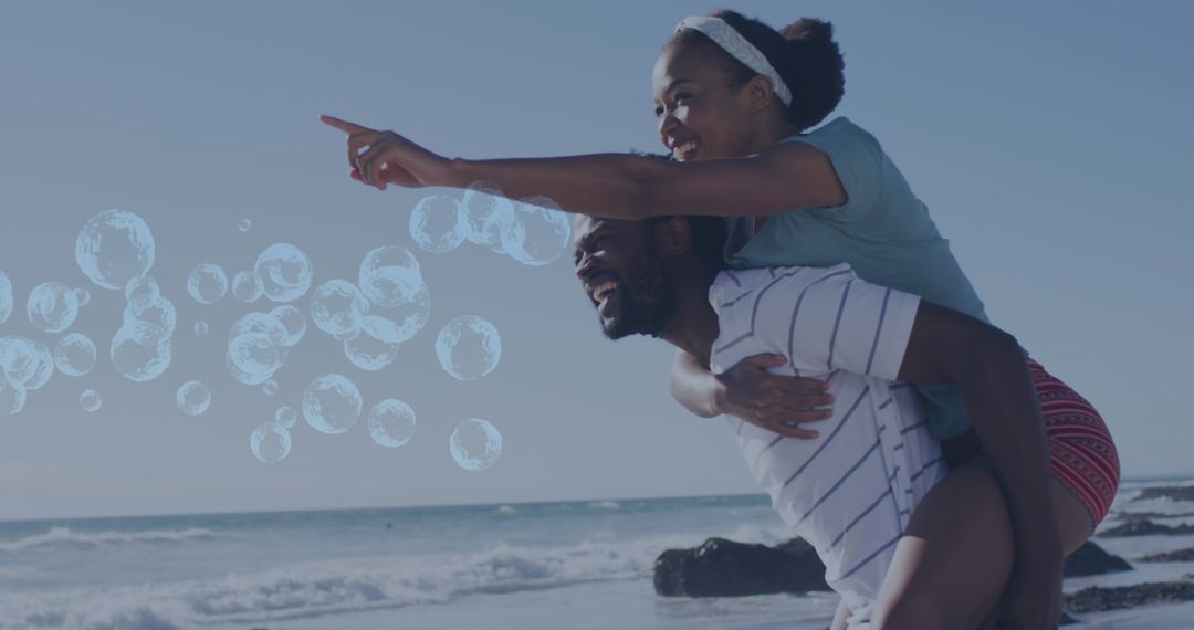 Joyful Couple Enjoying Beach with Digital Bubbles