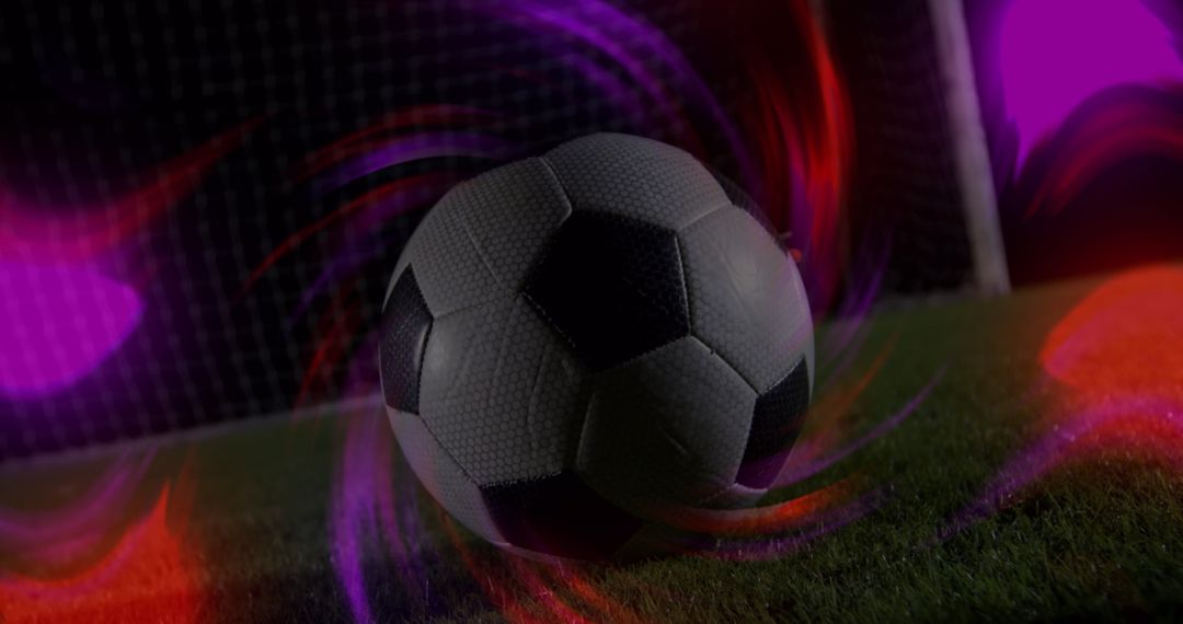 Dynamic Soccer Ball with Vibrant Light Trails on Field