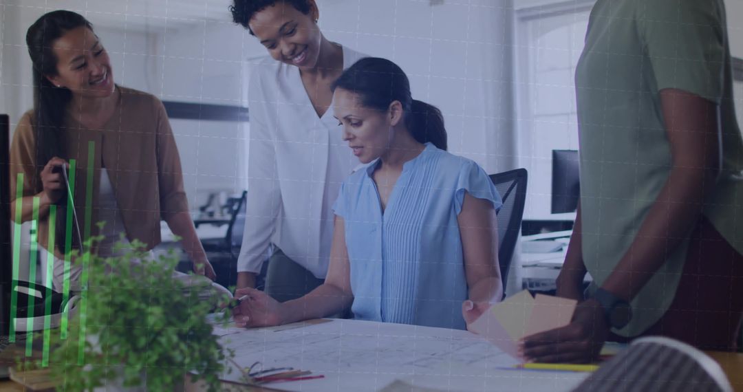Diverse Team Examining Blueprints in Open-Plan Office
