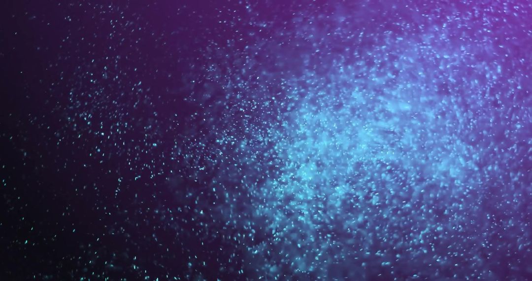 Glowing Particle Movement on Dark Background