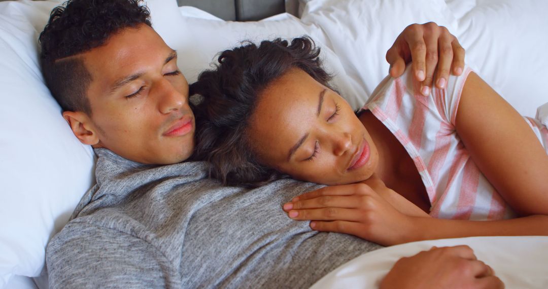 Young Couple Cuddling in Bed with Copy Space