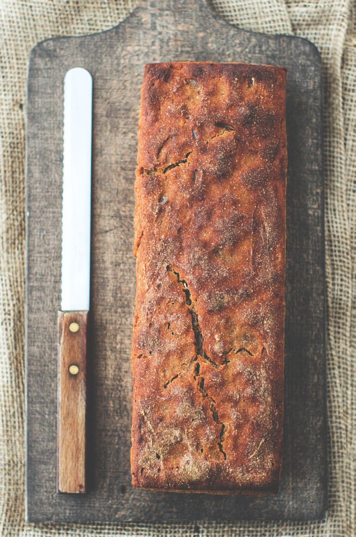 Freshly Baked Rye Bread on Wooden Cutting Board With Knife - Free Images, Stock Photos and Pictures on Pikwizard.com