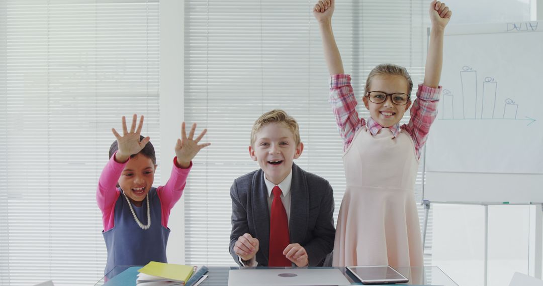 Joyful Children Celebrating Success During Group Presentation - Free Images, Stock Photos and Pictures on Pikwizard.com