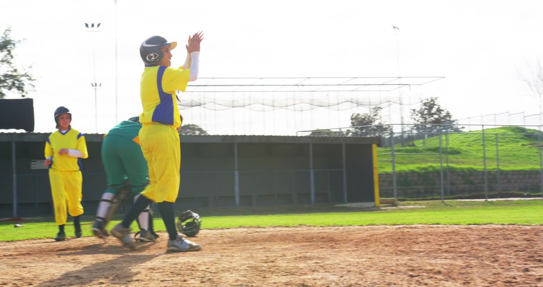 Young Softball Players Celebrating Home Run Success