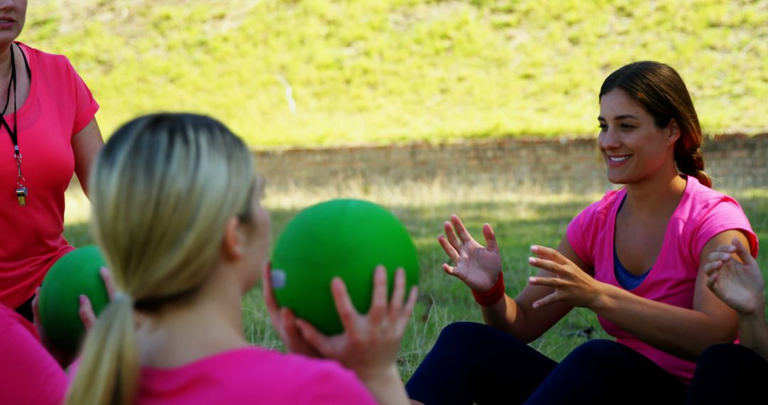 Women exercising outdoors with fitness ball in group training - Free Images, Stock Photos and Pictures on Pikwizard.com