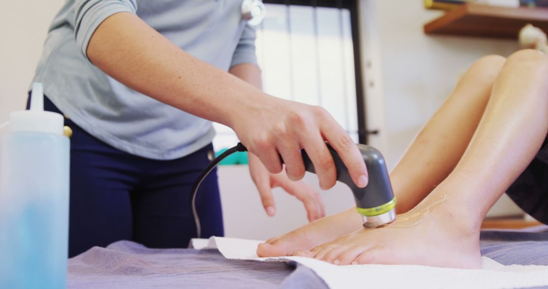 Physical therapist performing ultrasound therapy on patient's leg - Free Images, Stock Photos and Pictures on Pikwizard.com