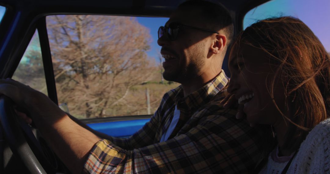 Young couple enjoying road trip in countryside during sunny day - Free Images, Stock Photos and Pictures on Pikwizard.com