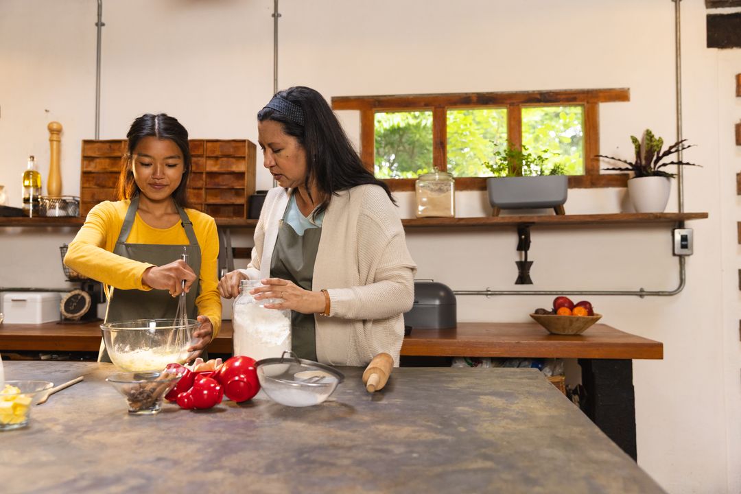 Mother and Daughter Enjoy Baking Together in Rustic Kitchen