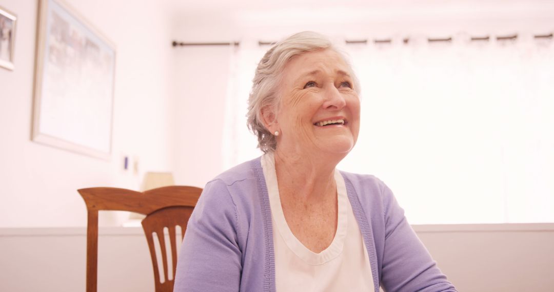 Happy Senior Woman Smiling at Home - Free Images, Stock Photos and Pictures on Pikwizard.com