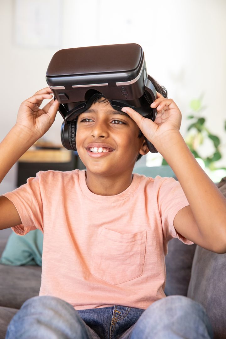 Indian Boy Engaging with Virtual Reality and Headphones at Home