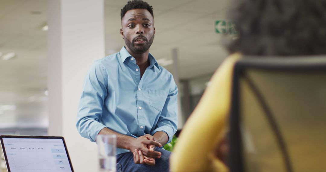 Focused Businessman Engaging with Colleague in Office