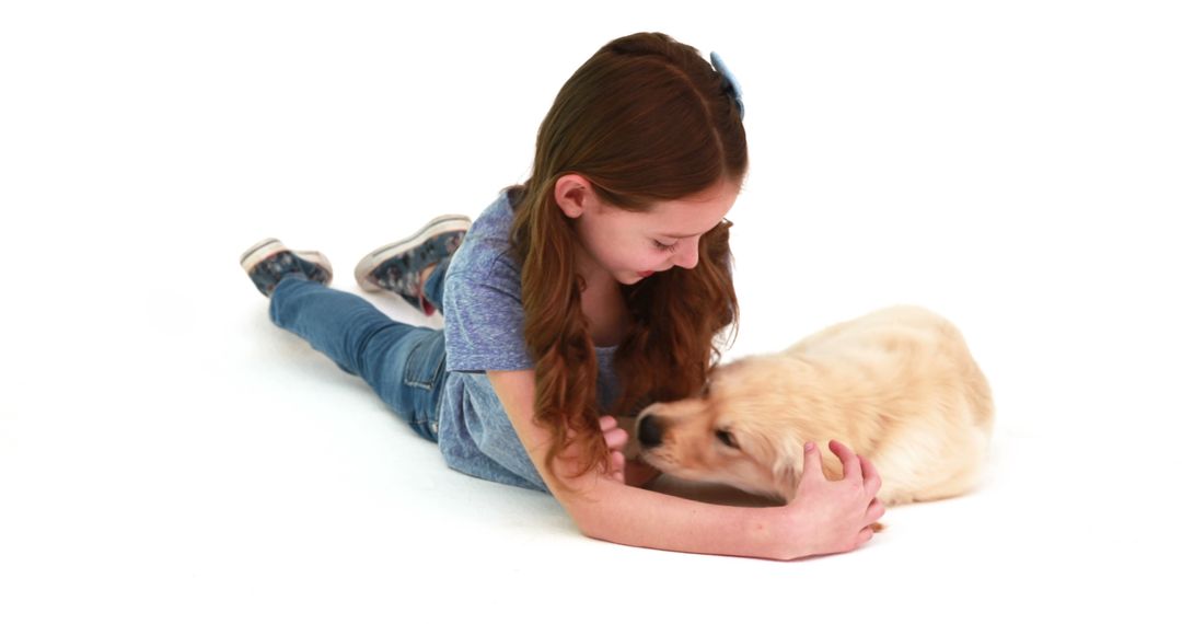 Joyful Child Playing with Energetic Golden Puppy on White Background - Free Images, Stock Photos and Pictures on Pikwizard.com