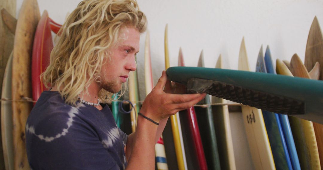 Surfer Repairing Surfboard In Workshop - Free Images, Stock Photos and Pictures on Pikwizard.com