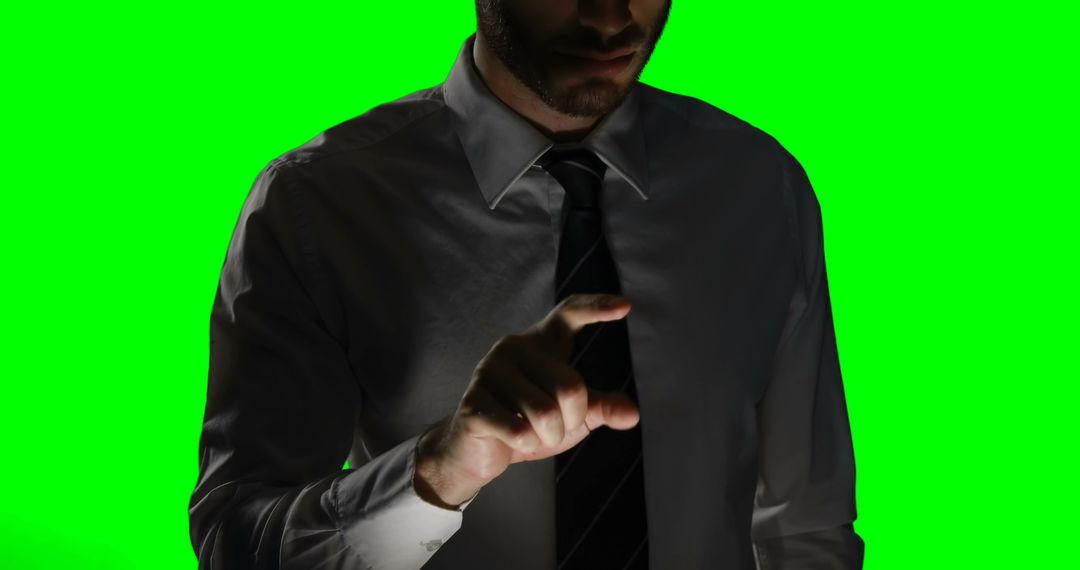 Man touching digital screen against green screen background - Free Images, Stock Photos and Pictures on Pikwizard.com