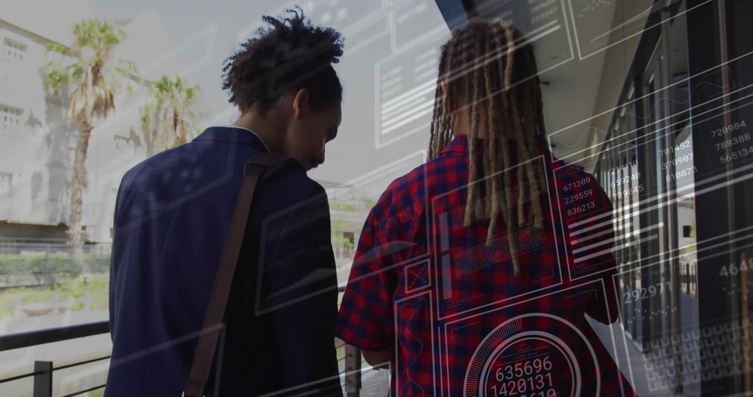 Colleagues Analyzing Digital Data in Outdoor Business Environment