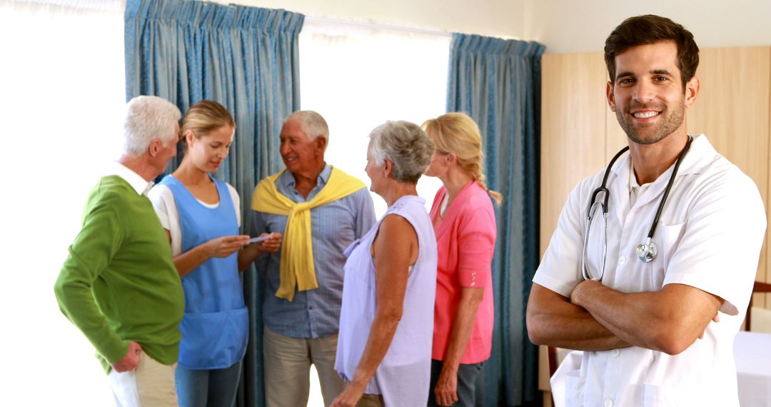 Doctor Smiling with Senior Patients and Caregivers in Hospital Room - Free Images, Stock Photos and Pictures on Pikwizard.com