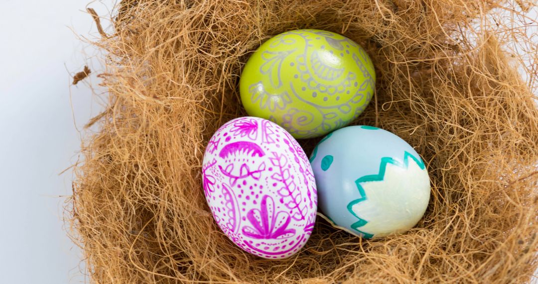 Colorful Hand-Decorated Easter Eggs in Nest